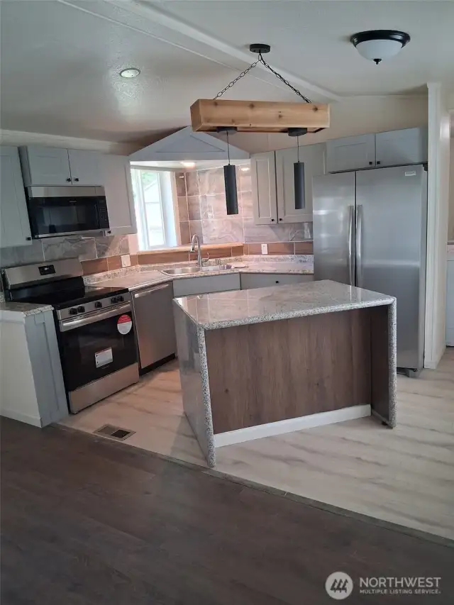 Remodeled kitchen with island.
