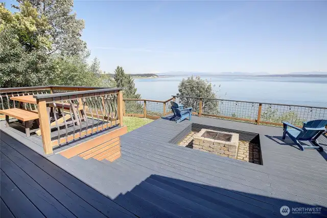 NEW Multi tiered deck w/covered spaces, outdoor dining, and firepit fun! Surrounded w/mountain + sound views, sunsets and the magic of salt water smells!  The perfect island lifestyle from this fully renovated home on Cavalero Road on Camano Island.