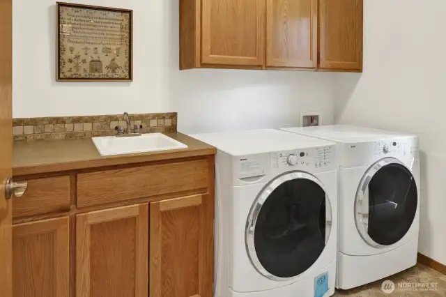 The laundry room is located just off the garage.