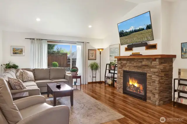 The great room off the kitchen features vaulted ceilings and a nice gas fire place to stay warm on the those cold winter nights.