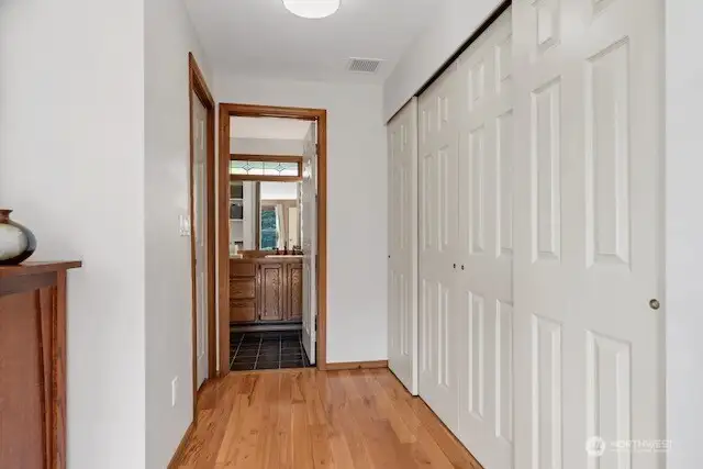 Primary bedroom hallway with closets