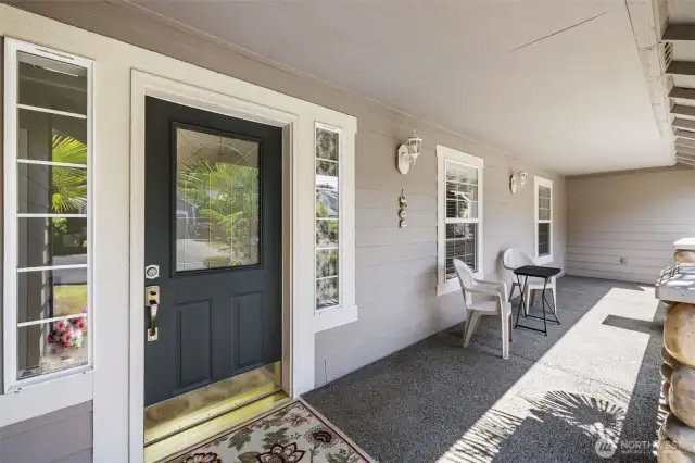 Inviting and expansive covered front porch entrance.