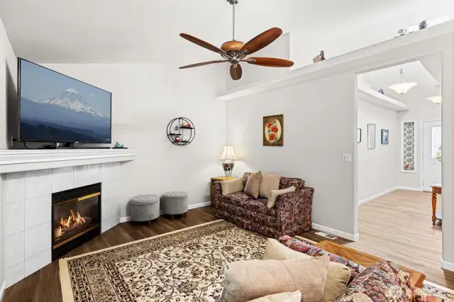 The family room with natural gas fireplace off the kitchen is a wonderful hub of the home.