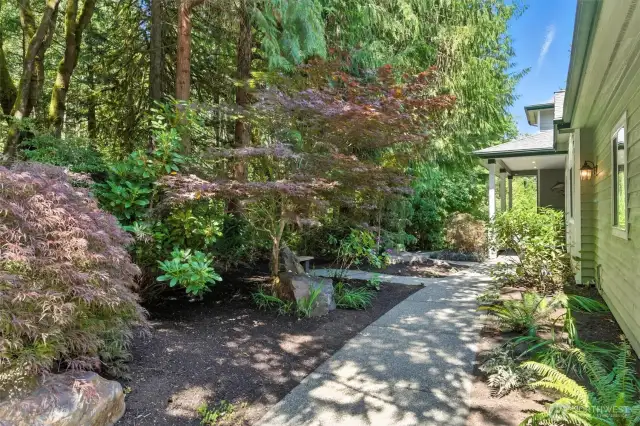 Beautifully landscaped path welcomes you to the front door