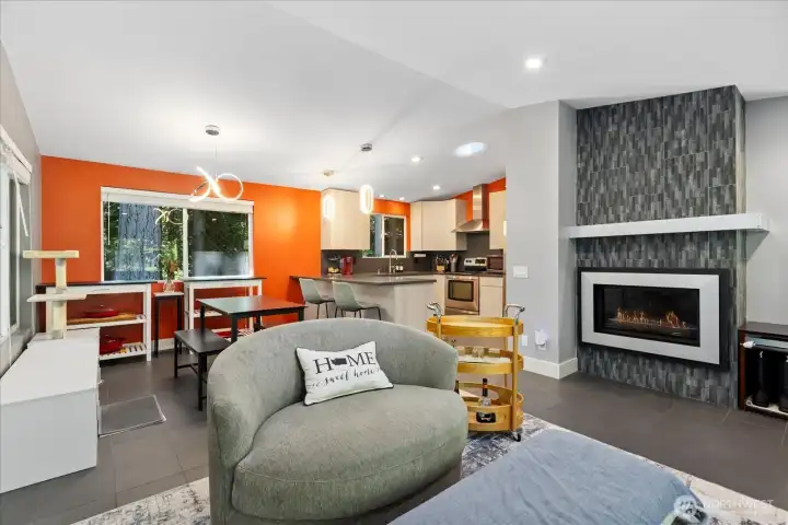 Open concept living with fireplace.