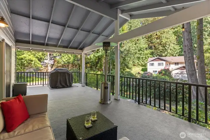 Huge covered deck great for entertaining or enjoying nature year round.