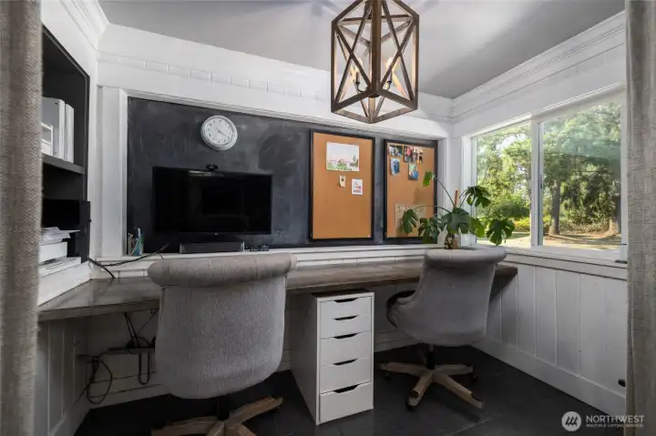 Close-up of office space with built-in desk and cubbies.