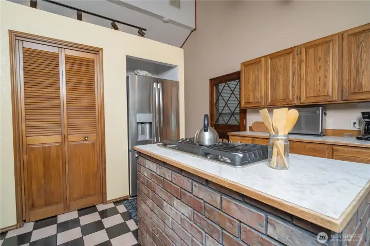 Stainless steel appliances, pantry and door to back deck, seamless for moving those dinners outside!