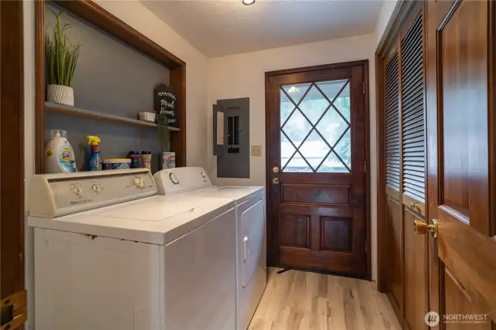 Laundry room with door to front deck. This room houses the electrical panel, water heater & furnace.