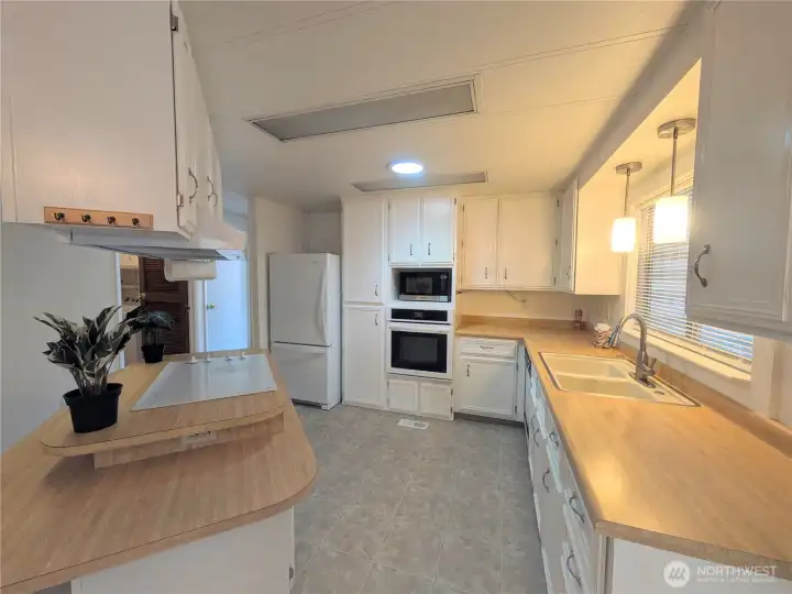 Bright light by oven is a light tube skylight.