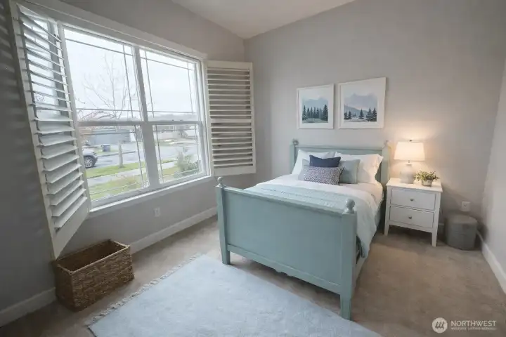 Second bedroom is tucked privately away, with an full bathroom adjacent, and check out the shutters you'll enjoy throughout much of this beautiful home.