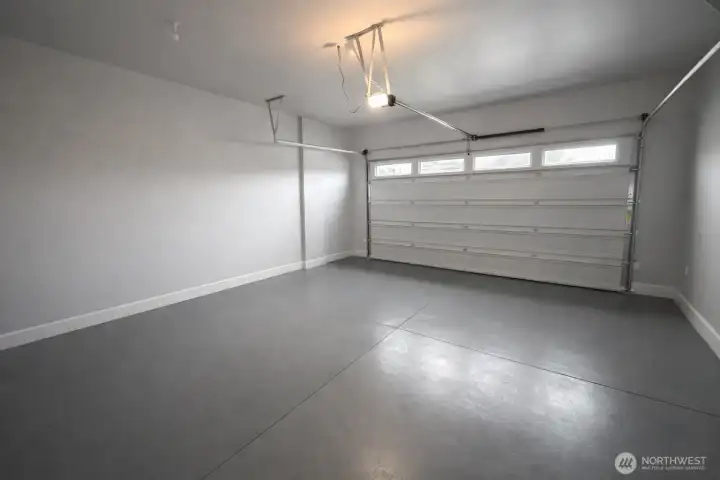 Seller will resurface the garage floor prior to closing. Just ask and include it in your offer. AI removed some convenient cabinets / shelving that can stay in this garage. (They are actually on the right.)
