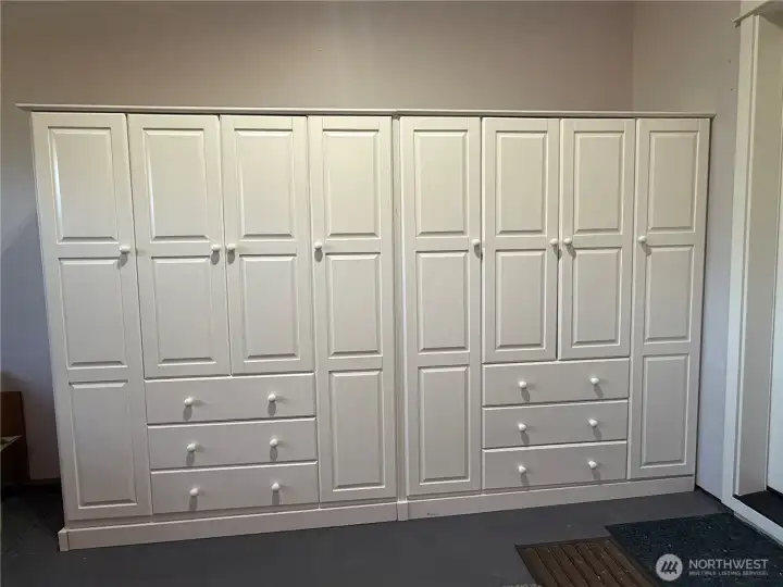 Built in cabinets that stay in the garage make for massive storage and there's STILL room for two cars :)