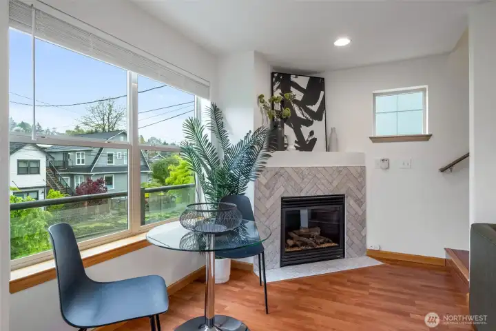 Cozy gas fireplace and dining area