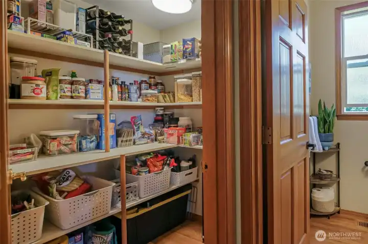 The amazing walk-in pantry is located just off of the kitchen.