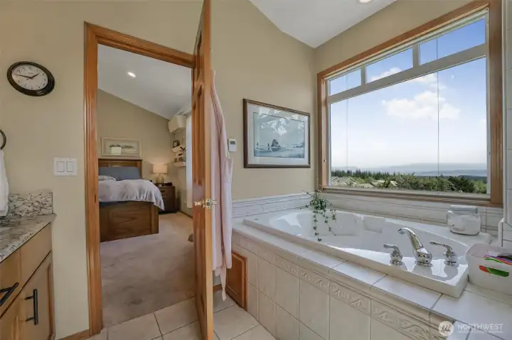 The 5-piece ensuite features double sinks, shower and soaking tub.