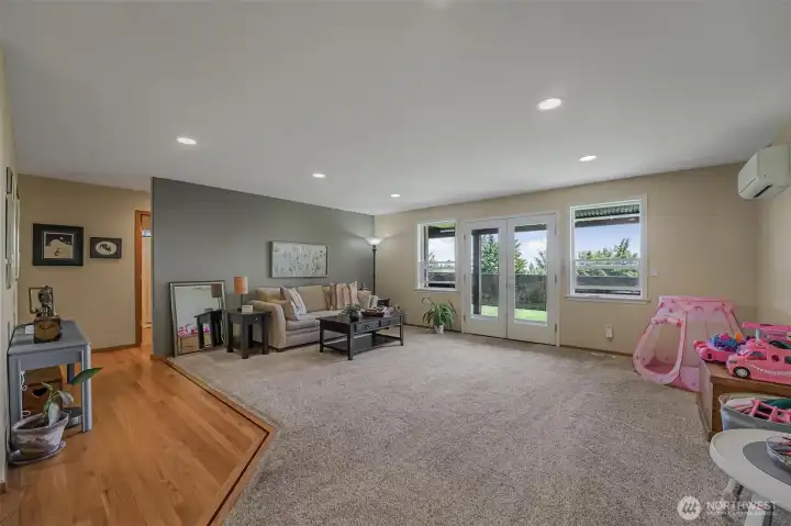 French doors lead outside to fenced area of the backyard.