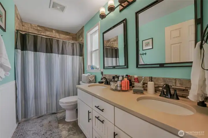 The full bathroom just off of the second bedroom.