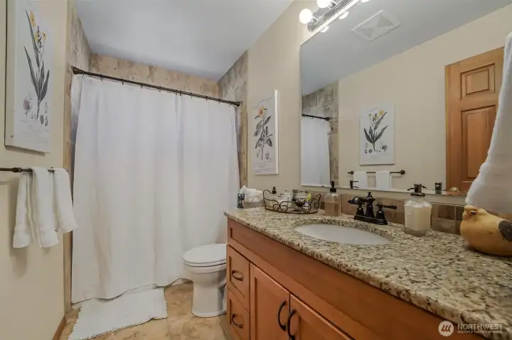 The full bathroom just off of the third bedroom.