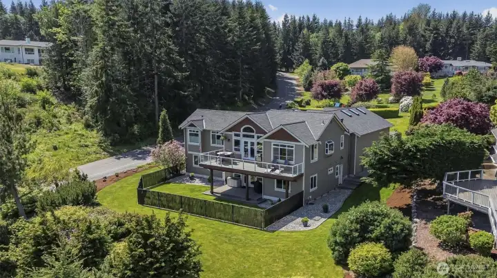Beautiful landscaping and almost 3.4 of an acre in the gated Camano Hills neighborhood.