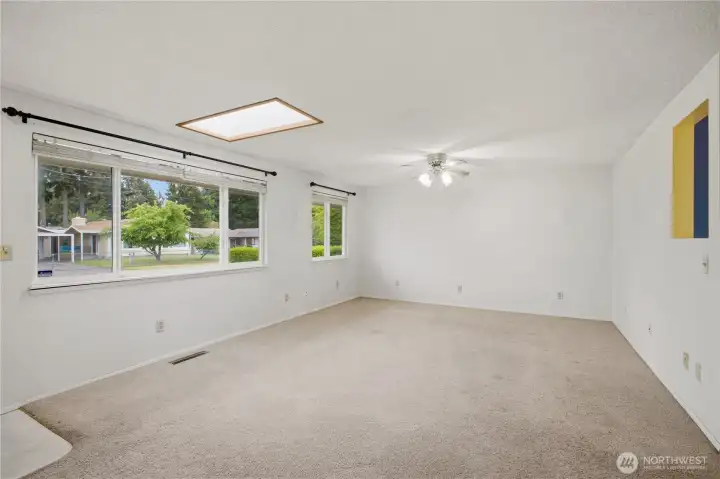 Large windows bring in natural light across the home’s main living areas. Large windows bring in natural light across the home’s main living areas.