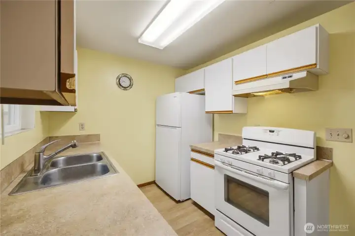 Clean kitchen space with potential to transform into your ideal cooking area. Clean kitchen space with potential to transform into your ideal cooking area.