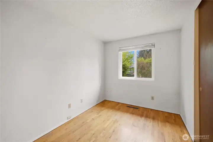 Front room features abundant natural light and mature landscaping views for added privacy. Front room features abundant natural light and mature landscaping views for added privacy.