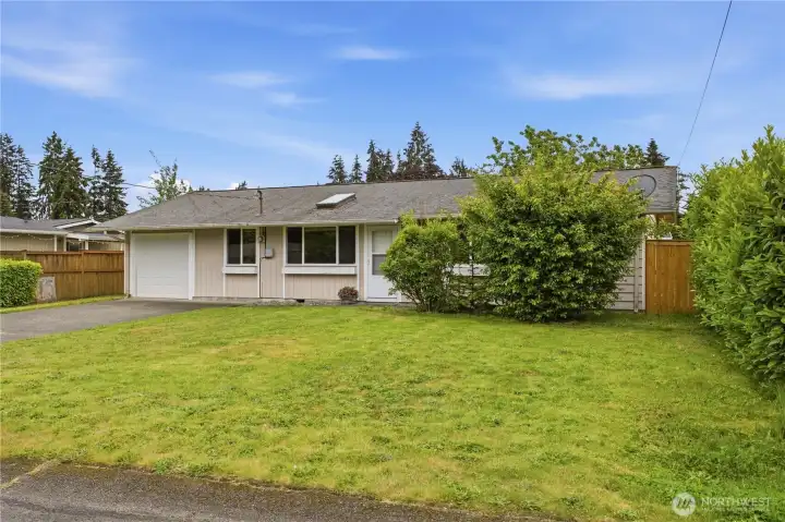Generous front yard offers space for landscaping, gardening, or outdoor enjoyment. Generous front yard offers space for landscaping, gardening, or outdoor enjoyment.