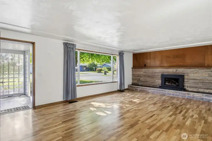 Front room offers beautiful original hardwood floors
