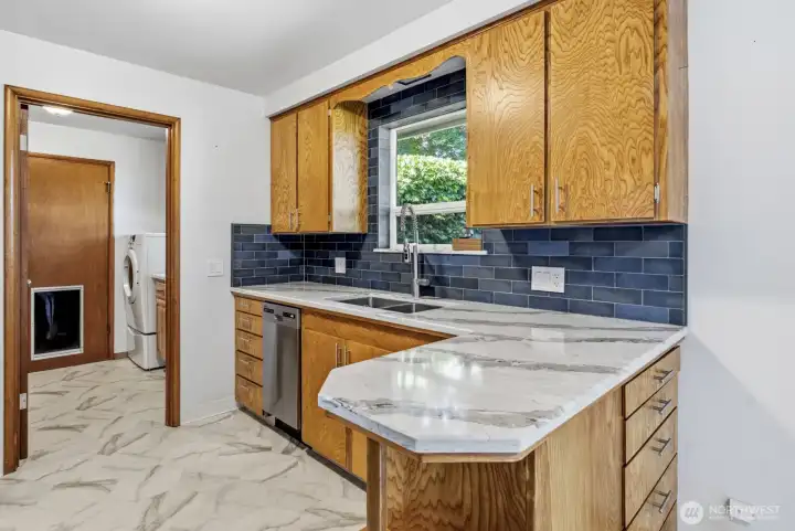 beautiful granite counter tops and refinished wood cabinetry