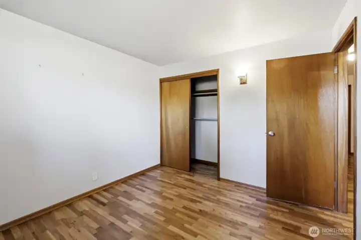 another view of the back bedroom showing the closet