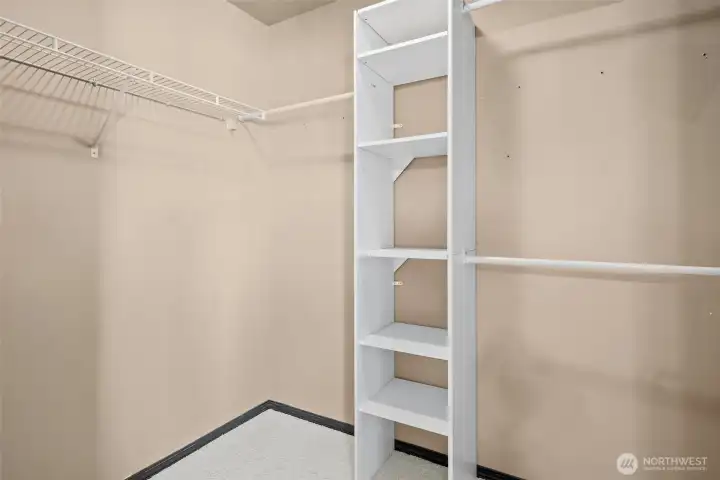 Primary bedroom walk-in closet