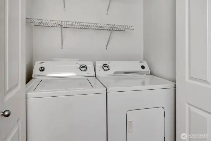 Laundry closet in hallway near den