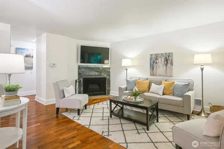 Wood-burning fireplace creates a warm, inviting space to relax and entertain. TV conveys Wood-burning fireplace creates a warm, inviting space to relax and entertain. TV conveys