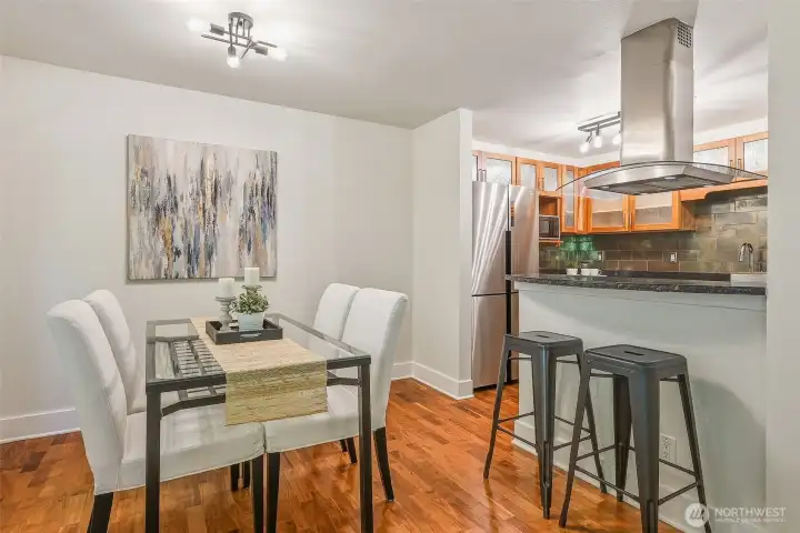 Dining area comfortably seats six and features a convenient buffet bar for serving Dining area comfortably seats six and features a convenient buffet bar for serving