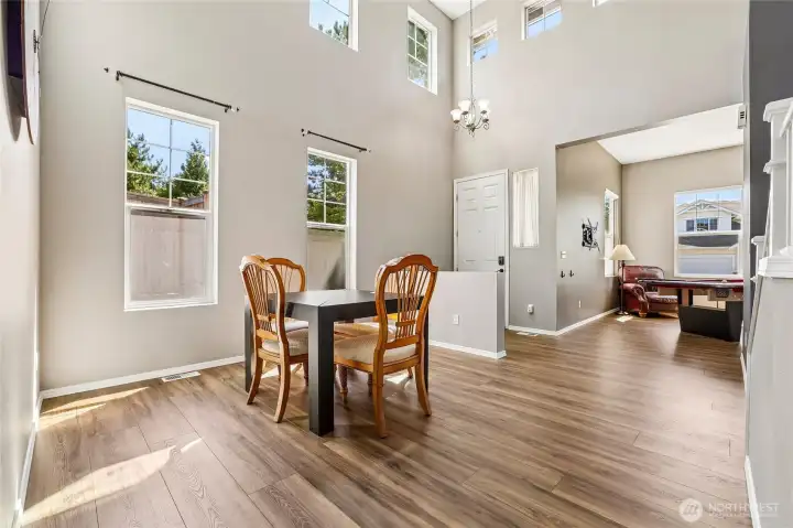 Spacious dining room with soaring 2 story ceilings & lots of natural light. Spacious dining room with soaring 2 story ceilings & lots of natural light.