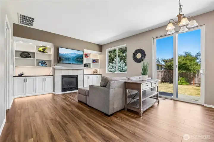 Amazing custom built-in cabinets & shelving on each side of the gas fireplace. Accent lighting above adds a wonderful touch. Amazing custom built-in cabinets & shelving on each side of the gas fireplace. Accent lighting above adds a wonderful touch.
