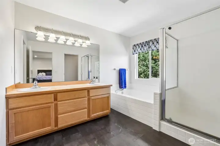 Primary 5 piece bath with dual sink vanity, soaking tub, big shower, private water closet & large walk-in closet Primary 5 piece bath with dual sink vanity, soaking tub, big shower, private water closet & large walk-in closet