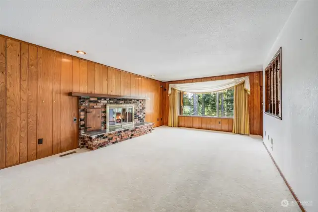 Living room.  (fire in fireplace is for photo only - gas is not currently connected)