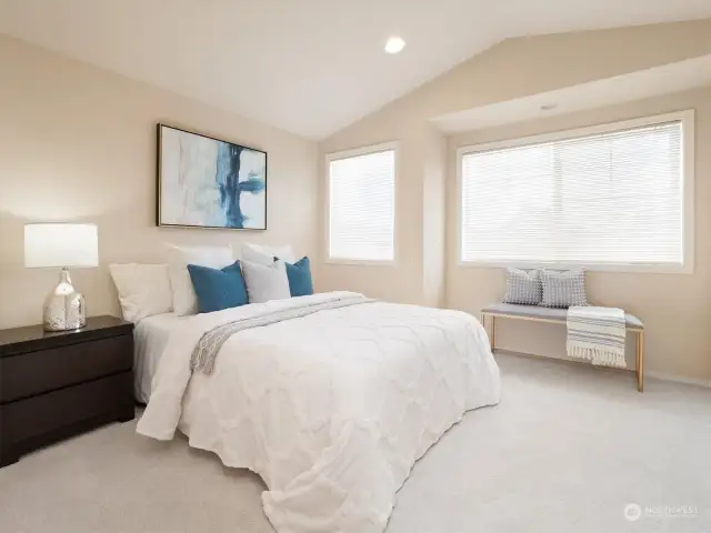 Main Bedroom graced by vaulted ceilings, large closets, and territorial views