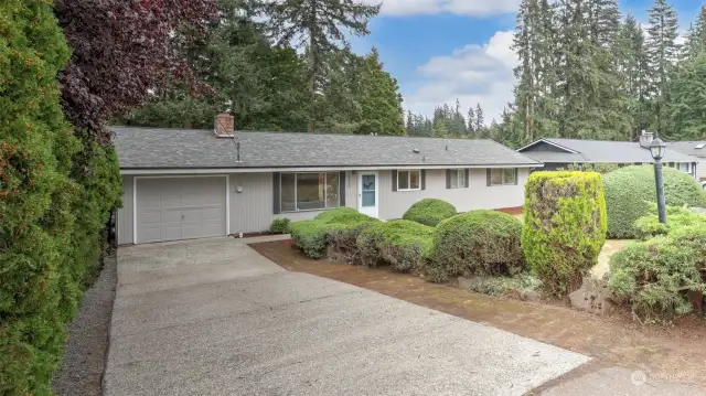 Spacious driveway plus storage space in garage.