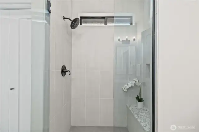 Primary bathroom with walk in shower and closet.