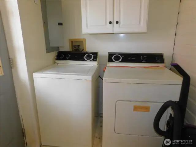 Laundry room is in back room by back door