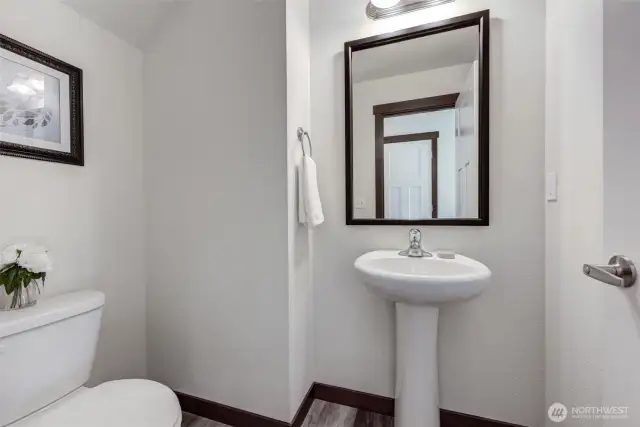 Half bath located in hallway off of living room.