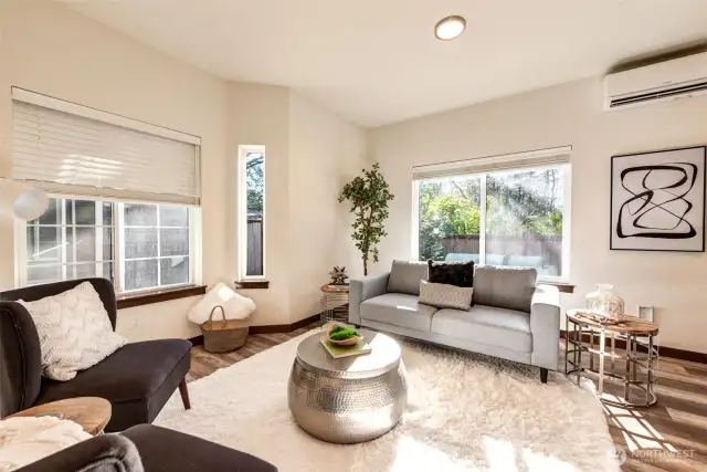 Spacious living room with bay window and an abundance of natural light.