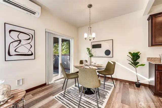 Bright and sunny dining area. Fantastic waterproof vinyl planked flooring. Slider to back patio.