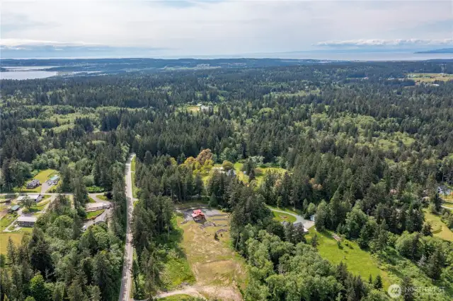 Beautiful view of the home with the property stretching out in front. This is island living at it's best, with state parks, beaches, boating, fishing, walking trails and so much more at your fingertips.