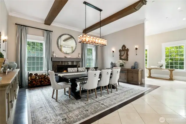 The formal dining room features wood-beamed ceilings and Italian marble flooring—an inviting space to host and gather.