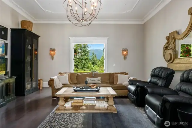 Open the French doors to extend the living space outdoors and step onto the covered patio where you can enjoy gentle breezes and take in serene views of the surrounding landscape. Whether you're sipping morning coffee or hosting evening guests, this seamless indoor-outdoor flow offers a luxurious yet relaxed lifestyle.