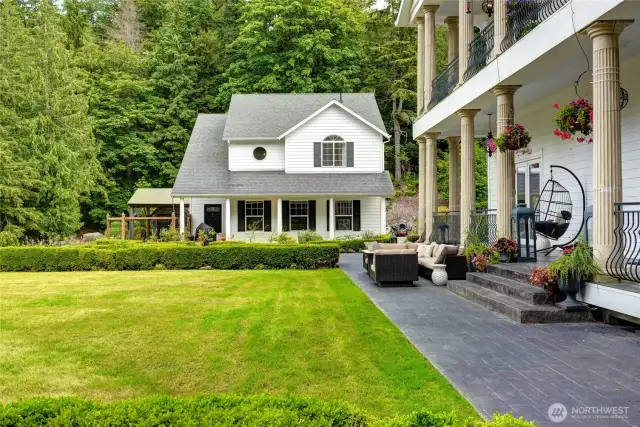 Detached 3 car garage with 2 bedroom/1 bath carriage house atop. A dedicated fenced dog run and spacious heated doghouse comfortably accommodate up to three dogs, while an in-ground wire collar system spans the entire property—giving your dogs the freedom to roam safely within the boundaries of home.
